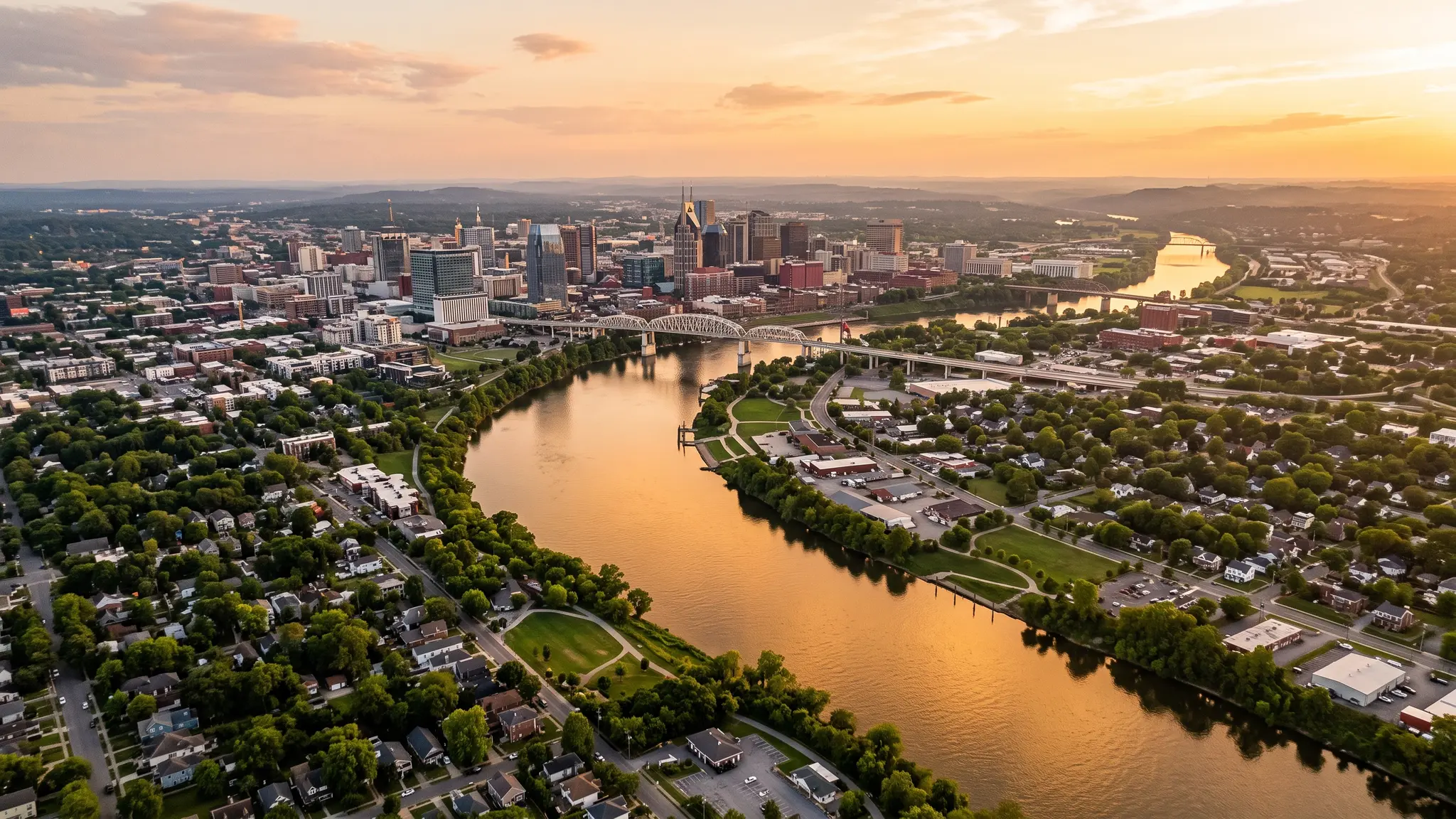 Handyman service areas in Middle Tennessee | Music City Handyguy Aerial view of the Cumberland River winding past the Nashville skyline and Middle Tennessee farmland at sunset